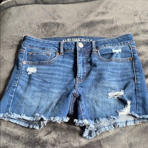 ripped blue jean shorts
